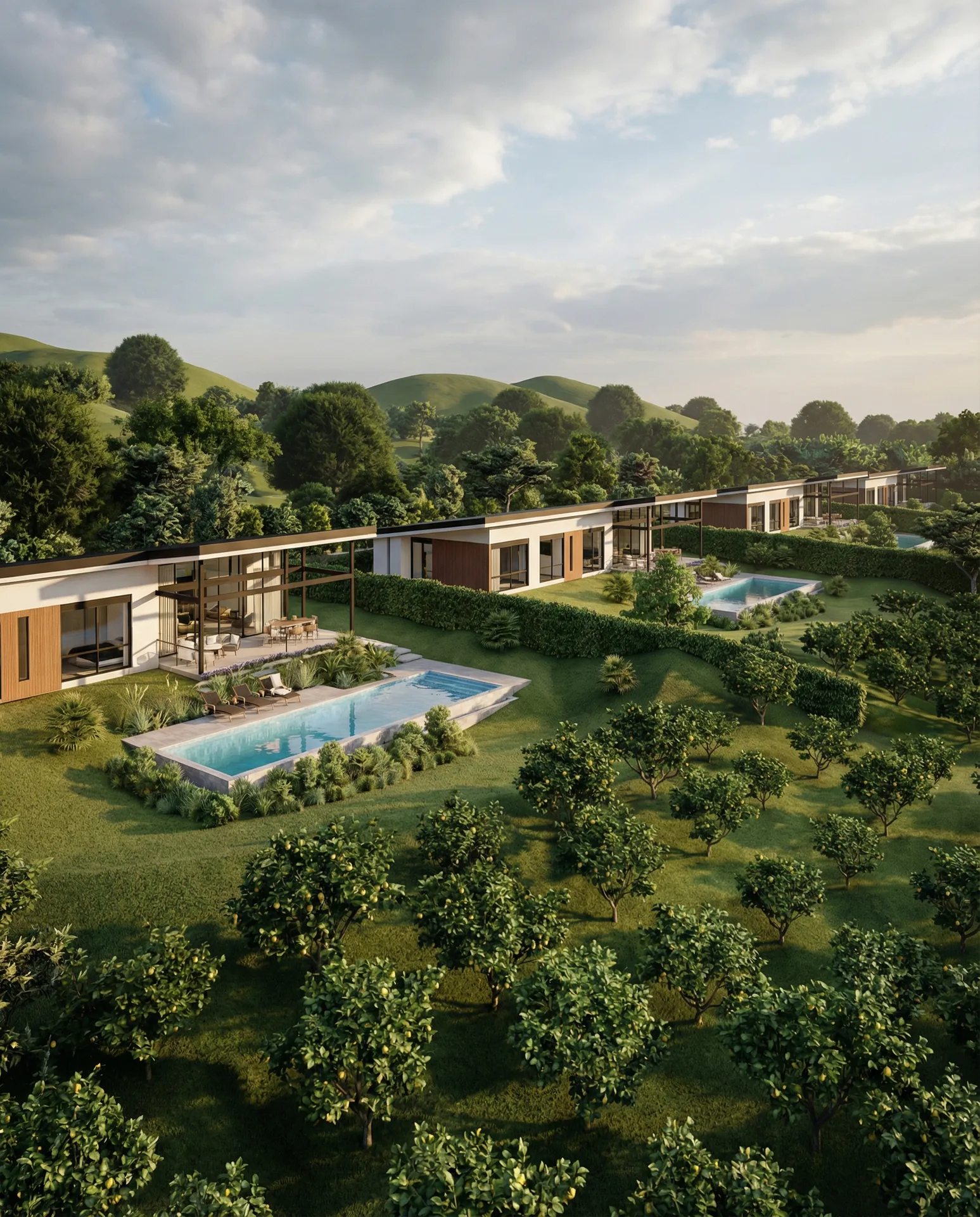Vista aerea del conjunto residencial Hacienda Primavera con piscinas privadas rodeado de vegetacion tropical